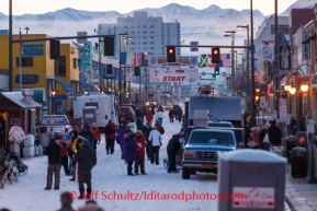 Mushers, handlers, media, sponsors, families, friends and VIP guests walk along Fourth Avenue prior to the ceremonial start of Iditarod 2014 in Anchorage, Alaska.Iditarod Sled Dog Race 2014PHOTO (c) BY JEFF SCHULTZ/IditarodPhotos.com -- REPRODUCTION PROHIBITED WITHOUT PERMISSION
