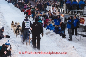 Jr. Iditarod winner Conway Seavey leaves the start line in for the honorary musher, Deby Trosper during the Iditarod 2014 Ceremonial start in downtown Anchorage, Alaska.Iditarod Sled Dog Race 2014PHOTO (c) BY JEFF SCHULTZ/IditarodPhotos.com -- REPRODUCTION PROHIBITED WITHOUT PERMISSION