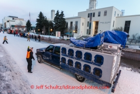 John Baker drives his dog truck to a parking spot on 4th avenue prior to the Iditarod 2014 Ceremonial start in downtown Anchorage, Alaska.Iditarod Sled Dog Race 2014PHOTO (c) BY JEFF SCHULTZ/IditarodPhotos.com -- REPRODUCTION PROHIBITED WITHOUT PERMISSION