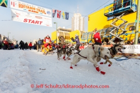 Returning champion, Mitch Seavey, leaves the starting line during the ceremonial start of Iditarod 2014 in Anchorage, Alaska.Iditarod Sled Dog Race 2014PHOTO (c) BY JEFF SCHULTZ/IditarodPhotos.com -- REPRODUCTION PROHIBITED WITHOUT PERMISSION