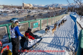Rookie musher, Katherine Keith of Kotzebue, drives her dog team along a ski trail along Tudor Road during the ceremonial start to Iditarod 2014 start in Anchorage, Alaska.Iditarod Sled Dog Race 2014PHOTO (c) BY JEFF SCHULTZ/IditarodPhotos.com -- REPRODUCTION PROHIBITED WITHOUT PERMISSION