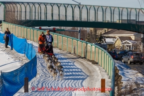 Mike Ellis drives his dogs along a trail paralleling Tudor Road during the ceremonial start of Iditarod 2014 start in Anchorage, Alaska.Iditarod Sled Dog Race 2014PHOTO (c) BY JEFF SCHULTZ/IditarodPhotos.com -- REPRODUCTION PROHIBITED WITHOUT PERMISSION