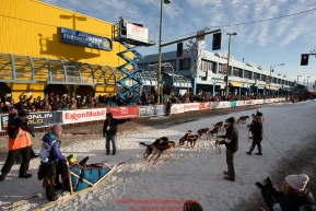 Shaynee Traska leaves the 4th avenue start line during the ceremonial start of the 2019 Iditarod in downtown Anchorage, Alaska on Saturday March 2.Photo by Jeff Schultz/  (C) 2019  ALL RIGHTS RESERVED