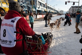 Kristin Bacon leaves the start line during the ceremonial start of the 2019 Iditarod in downtown Anchorage, Alaska on Saturday March 2.Photo by Jeff Schultz/  (C) 2019  ALL RIGHTS RESERVED