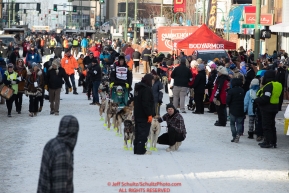 Matt Hall's handlers bring him slowly down 4th avenue to the start line during the 2019 ceremonial start of the Iditarod in downtown Anchorage, Alaska on Saturday March 2.Photo by Jeff Schultz/  (C) 2019  ALL RIGHTS RESERVED