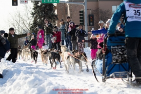 Brett Bruggeman gives high-fives on Cordova Street with his Iditarider during the ceremonial start of the 2019 Iditarod in downtown Anchorage, Alaska on Saturday March 2.Photo by Jeff Schultz/  (C) 2019  ALL RIGHTS RESERVED