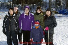 Saturday March 10, 2012 Marina Isaac, Faith Amend, Tamah Moses, Sandy Scotten, Hawken Scotten, Andrea Smith in Galena, Alaska:  volunteer dog lot attendants. Iditarod 2012.