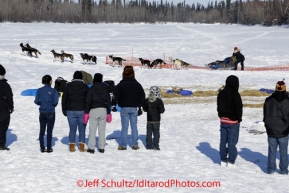 Saturday March 10, 2012  Galena students watch as Kelley Griffin tries to leave the Galena checkpoint. Kelley is waiting for her dogs to finish pooping. Iditarod 2012.