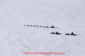 Saturday March 10, 2012 A dog team finds company along the Yukon river in the form of two travelers on snow machines, between Galena and Nulato. Iditarod 2012.