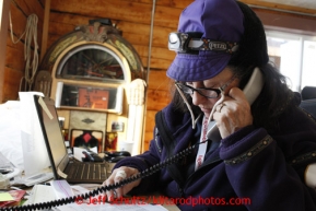 Volunteer Comms Nancy Yoshida works comms at the Shageluk checkpoint on Saturday March 9, 2013.Iditarod Sled Dog Race 2013Photo by Jeff Schultz copyright 2013 DO NOT REPRODUCE WITHOUT PERMISSION