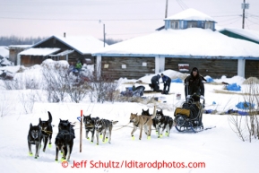 Brent Sass leaves his parking spot at the Kaltag checkpoint on Sunday March 10, 2013.Iditarod Sled Dog Race 2013Photo by Jeff Schultz copyright 2013 DO NOT REPRODUCE WITHOUT PERMISSION