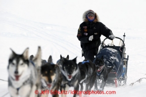 Matt Failor walks up the bank of the Yukon River into the Kaltag checkpoint with his team on Sunday March 10, 2013.Iditarod Sled Dog Race 2013Photo by Jeff Schultz copyright 2013 DO NOT REPRODUCE WITHOUT PERMISSION