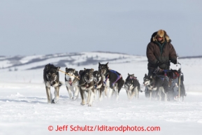 Sonny Lindner passes a race marker as he heads into the Unalakleet checkpoint on Sunday March 10, 2013.Iditarod Sled Dog Race 2013Photo by Jeff Schultz copyright 2013 DO NOT REPRODUCE WITHOUT PERMISSION