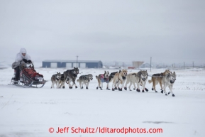 Aliy Zirkle ducks down into a direct headwind shorlty after leaving the Unalakleet checkpoint on Sunday March 10, 2013.Iditarod Sled Dog Race 2013Photo by Jeff Schultz copyright 2013 DO NOT REPRODUCE WITHOUT PERMISSION