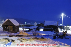 Teams rest on straw in the early morning at the Kaltag checkpoint on Sunday March 10, 2013.Iditarod Sled Dog Race 2013Photo by Jeff Schultz copyright 2013 DO NOT REPRODUCE WITHOUT PERMISSION