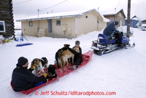 Volunteers prepare to take dropped dogs by sled to the airport at the Kaltag checkpoint on Sunday March 10, 2013.Iditarod Sled Dog Race 2013Photo by Jeff Schultz copyright 2013 DO NOT REPRODUCE WITHOUT PERMISSION