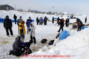 People check out the resting dog teams at the Unalakleet checkpoint on Sunday March 10, 2013.Iditarod Sled Dog Race 2013Photo by Jeff Schultz copyright 2013 DO NOT REPRODUCE WITHOUT PERMISSION