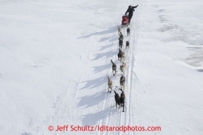 Jeff King runs on the slough shortly after leaving the Unalakleet checkpoint on Sunday March 10, 2013.Iditarod Sled Dog Race 2013Photo by Jeff Schultz copyright 2013 DO NOT REPRODUCE WITHOUT PERMISSION