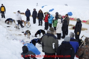 A crowd at the Unalakleet checkpoint gathers to see Martin Buser as he arrived on Sunday March 10, 2013.Iditarod Sled Dog Race 2013Photo by Jeff Schultz copyright 2013 DO NOT REPRODUCE WITHOUT PERMISSION