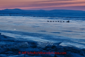 Michelle Phillips crosses Norton Sound a dawn as she nears  Koyuk on Monday March 10, during the Iditarod Sled Dog Race 2014.PHOTO (c) BY JEFF SCHULTZ/IditarodPhotos.com -- REPRODUCTION PROHIBITED WITHOUT PERMISSION