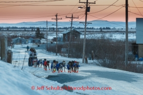 Michelle Phillips runs down the road on her way into Koyuk on Monday March 10, during the Iditarod Sled Dog Race 2014.PHOTO (c) BY JEFF SCHULTZ/IditarodPhotos.com -- REPRODUCTION PROHIBITED WITHOUT PERMISSION