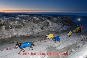 Wade Marrs runs through jumbled sea ice on a trail in front of Koyuk on Monday March 10, during the Iditarod Sled Dog Race 2014.PHOTO (c) BY JEFF SCHULTZ/IditarodPhotos.com -- REPRODUCTION PROHIBITED WITHOUT PERMISSION