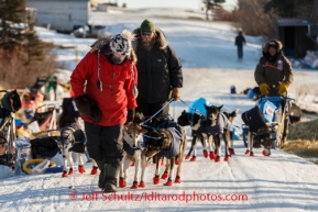 Volunteers assist Robert Sorlie out of Koyuk on Monday, March 10, during the Iditarod Sled Dog Race 2014.PHOTO (c) BY JEFF SCHULTZ/IditarodPhotos.com -- REPRODUCTION PROHIBITED WITHOUT PERMISSION