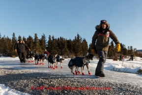 Robert Sorlie helps his dogs move along glare ice in Koyuk on Monday, March 10, during the Iditarod Sled Dog Race 2014.PHOTO (c) BY JEFF SCHULTZ/IditarodPhotos.com -- REPRODUCTION PROHIBITED WITHOUT PERMISSION