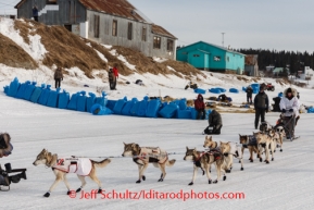 Race fans and media watch as Aliy Zirkle prepares to leave White Mountain after her 8-hour layover on Monday, March 10, during the Iditarod Sled Dog Race 2014.PHOTO (c) BY JEFF SCHULTZ/IditarodPhotos.com -- REPRODUCTION PROHIBITED WITHOUT PERMISSION