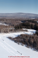 Two teams travel on a slough about 4 miles from the checkpoint at Manley Hot Springs on March 10, 2015.  This is the second checkpoint of the 2015 Iditarod.(C) Jeff Schultz/SchultzPhoto.com - ALL RIGHTS RESERVED DUPLICATION  PROHIBITED  WITHOUT  PERMISSION