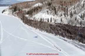 Three teams run down the Tanana River about 6 miles from  the checkpoint at Manley Hot Springs on March 10, 2015.  This is the second checkpoint of the 2015 Iditarod.(C) Jeff Schultz/SchultzPhoto.com - ALL RIGHTS RESERVED DUPLICATION  PROHIBITED  WITHOUT  PERMISSION