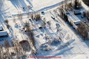 A team runs through town at the checkpoint in Manley Hot Springs on March 10, 2015.  This is the second checkpoint of the 2015 Iditarod.(C) Jeff Schultz/SchultzPhoto.com - ALL RIGHTS RESERVED DUPLICATION  PROHIBITED  WITHOUT  PERMISSION