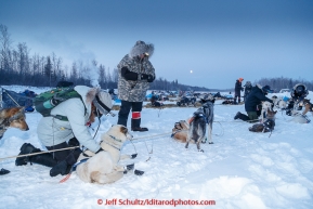 Volunteer vets check Chuck Schaeffer's team in the morning at the checkpoint in Manley on Tuesday March 10, 2015.  This is the second checkpoint of the 2015 Iditarod.(C) Jeff Schultz/SchultzPhoto.com - ALL RIGHTS RESERVED DUPLICATION  PROHIBITED  WITHOUT  PERMISSION