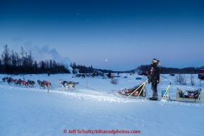 Joar Leifseth runs into the pit area in the morning at the checkpoint in Manley on Tuesday March 10, 2015.  This is the second checkpoint of the 2015 Iditarod.(C) Jeff Schultz/SchultzPhoto.com - ALL RIGHTS RESERVED DUPLICATION  PROHIBITED  WITHOUT  PERMISSION