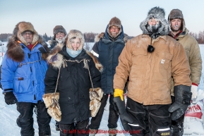 The volunteer pit crew poses for a photo .in the morning at the checkpoint in Manley on Tuesday March 10, 2015.  This is the second checkpoint of the 2015 Iditarod.(C) Jeff Schultz/SchultzPhoto.com - ALL RIGHTS RESERVED DUPLICATION  PROHIBITED  WITHOUT  PERMISSION