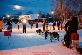 John Baker arrives as a near-full moon sets over the Huslia checkpoint during the 2017 Iditarod on Friday morning March 10, 2017.Photo by Jeff Schultz/SchultzPhoto.com  (C) 2017  ALL RIGHTS RESERVED