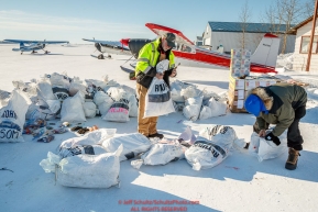 Longtime trail volunteers John Hooley and Randy Johnson sort through musher return bags at the Galena airport during the 2017 Iditarod on Friday afternoon March 10, 2017.Photo by Jeff Schultz/SchultzPhoto.com  (C) 2017  ALL RIGHTS RESERVED