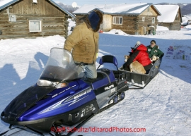 Sunday March 11, 2012    Long-time checker Rich Burnham drives a sled with dropped dogs headed to the airport at the Kaltag checkpoint. Iditarod 2012.