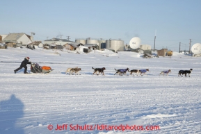 Jessica Hendricks pulls away from the Unalakleet checkpoint on Monday March 11, 2013.Iditarod Sled Dog Race 2013Photo by Jeff Schultz copyright 2013 DO NOT REPRODUCE WITHOUT PERMISSION