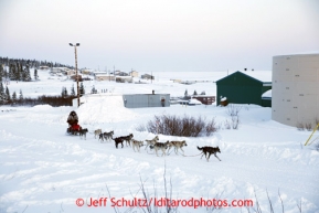 Jeff King rolls into the Elim checkpoint just after sunset on Monday March 11, 2013.Iditarod Sled Dog Race 2013Photo by Jeff Schultz copyright 2013 DO NOT REPRODUCE WITHOUT PERMISSION