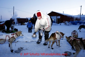 Aily Zirkle feeds her dog team at the Elim checkpoint on Monday March 11, 2013.Iditarod Sled Dog Race 2013Photo by Jeff Schultz copyright 2013 DO NOT REPRODUCE WITHOUT PERMISSION