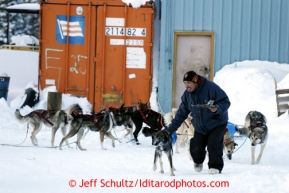 Carl Paul leads Jeff King's team into the Elim checkpoint on Monday March 11, 2013.Iditarod Sled Dog Race 2013Photo by Jeff Schultz copyright 2013 DO NOT REPRODUCE WITHOUT PERMISSION