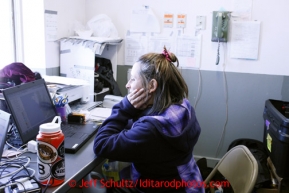 Kathy Cappa monitors teams by GPS at the comm stations at the Shaktoolik checkpoint on Monday March 11, 2013.Iditarod Sled Dog Race 2013Photo by Jeff Schultz copyright 2013 DO NOT REPRODUCE WITHOUT PERMISSION