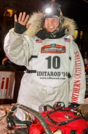 Aliy Zirkle waves to the crowd shorlty after finishing in second place during the Iditarod Sled Dog Race 2014.PHOTO (c) BY JEFF SCHULTZ/IditarodPhotos.com -- REPRODUCTION PROHIBITED WITHOUT PERMISSION