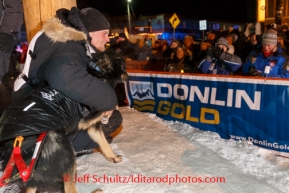 Dallas Seavey poses with his lead dog Beatle for race fans shortly after winning the 2014 Iditarod in Nome on Tuesday, March 11, during the Iditarod Sled Dog Race 2014.PHOTO (c) BY JEFF SCHULTZ/IditarodPhotos.com -- REPRODUCTION PROHIBITED WITHOUT PERMISSION