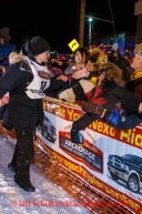 Dallas Seavey shakes the hands of race fans shortly after winning the 2014 Iditarod in Nome on Tuesday, March 11, during the Iditarod Sled Dog Race 2014.PHOTO (c) BY JEFF SCHULTZ/IditarodPhotos.com -- REPRODUCTION PROHIBITED WITHOUT PERMISSION