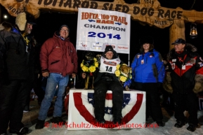 Iditarod sponsors stand with 2014 Iditarod Champion Dallas Seavey at the winner 's circle in Nome on Tuesday, March 11, during the Iditarod Sled Dog Race 2014.PHOTO (c) BY JEFF SCHULTZ/IditarodPhotos.com -- REPRODUCTION PROHIBITED WITHOUT PERMISSION