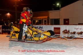 Mitch Seavey arrives into the Nome finish chute to claim 3rd place on Tuesday March 11th during the 2014 Iditarod Sled Dog Race.PHOTO (c) BY JEFF SCHULTZ/IditarodPhotos.com -- REPRODUCTION PROHIBITED WITHOUT PERMISSION