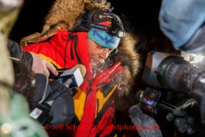 Mitch Seavey talks to reporters shortly after claiming 3rd place at the Nome finish line on Tuesday March 11th during the 2014 Iditarod Sled Dog Race.PHOTO (c) BY JEFF SCHULTZ/IditarodPhotos.com -- REPRODUCTION PROHIBITED WITHOUT PERMISSION