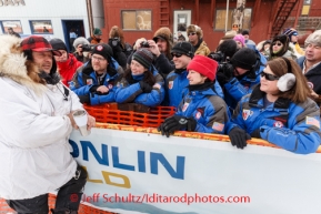 Shorlty after arriving in 6th place at Nome, Martin Buser talks with race sponsor representatives from ExxonMobil on Tuesday March 11th during the 2014 Iditarod Sled Dog Race.PHOTO (c) BY JEFF SCHULTZ/IditarodPhotos.com -- REPRODUCTION PROHIBITED WITHOUT PERMISSION